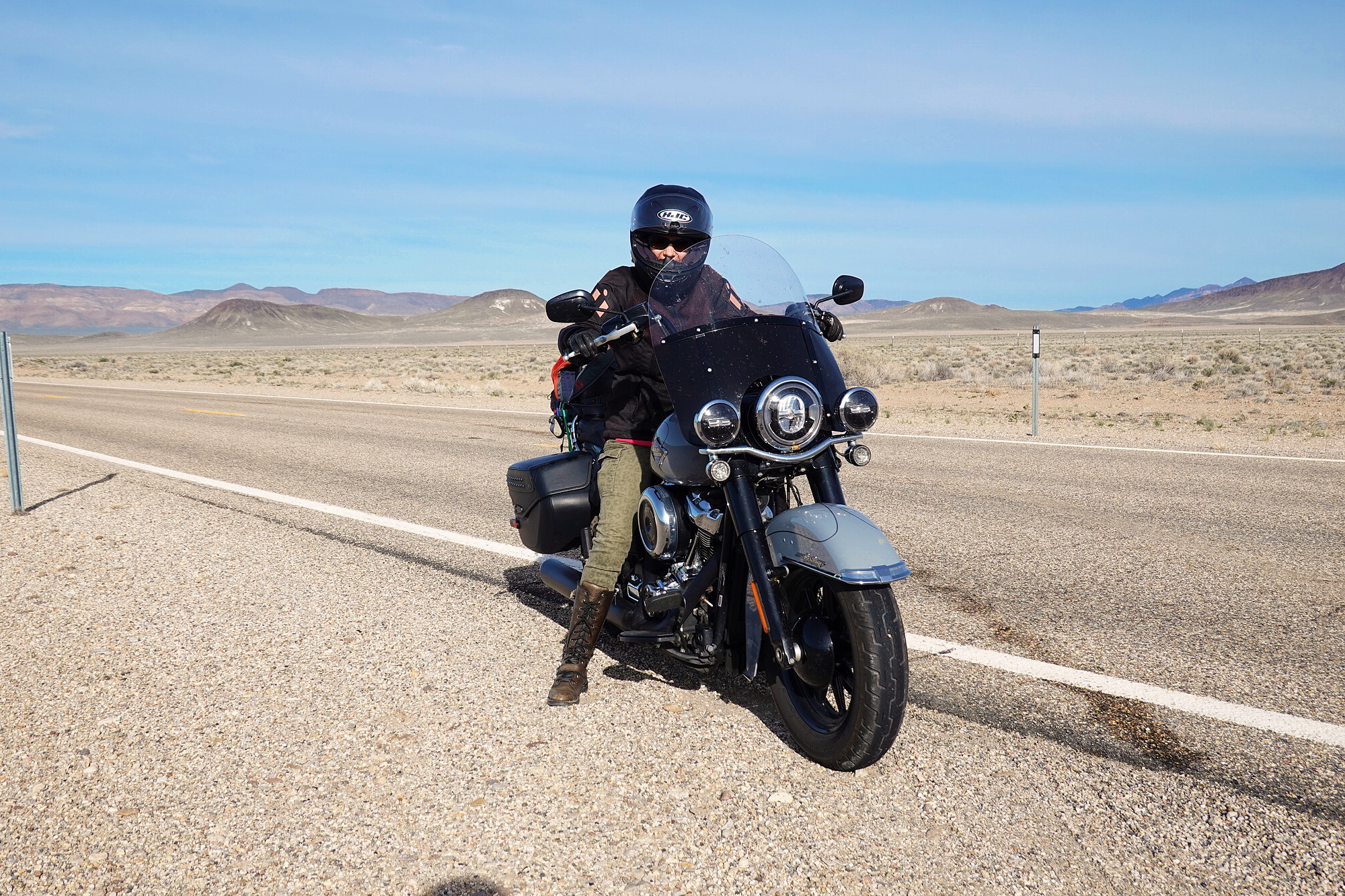 Riding out early meant a long deserted road - but David still needed to stop for sunscreen.